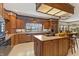 Spacious kitchen with wood cabinets, an island, and modern appliances at 7400 Oakbay Dr, Noblesville, IN 46062