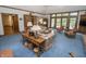 Spacious living room with large windows and comfortable seating at 7400 Oakbay Dr, Noblesville, IN 46062
