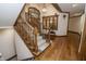 Staircase featuring carpeted steps, hardwood flooring, and a window at 7400 Oakbay Dr, Noblesville, IN 46062