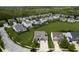 Expansive aerial view showcases the neighborhood with lush greenery and well-spaced homes at 7632 Nestucca Trl, Noblesville, IN 46062