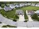 Aerial view of a well-maintained neighborhood featuring a home with a spacious driveway and backyard at 7632 Nestucca Trl, Noblesville, IN 46062