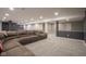 Basement featuring neutral carpet, recessed lighting, structural column, and a large sectional couch at 7632 Nestucca Trl, Noblesville, IN 46062