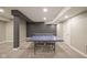 Finished basement with neutral carpet, recessed lighting, and a ping pong table at 7632 Nestucca Trl, Noblesville, IN 46062