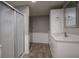 Bathroom with white cabinets, quartz countertop, framed mirror, and a glass shower at 7632 Nestucca Trl, Noblesville, IN 46062