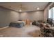 Bedroom featuring neutral carpet, a ceiling fan, a window, and a desk at 7632 Nestucca Trl, Noblesville, IN 46062