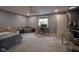 Bedroom with neutral carpet, a ceiling fan, a window, and a desk at 7632 Nestucca Trl, Noblesville, IN 46062