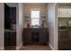 Coffee bar located between kitchen and dining area with coffee accessories, wine rack and serving area at 7632 Nestucca Trl, Noblesville, IN 46062