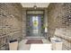 Close-up of the front door with decorative glass and a welcoming sunflower accent at 7632 Nestucca Trl, Noblesville, IN 46062