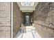 Inviting front entryway with brick walls, potted plants, and a decorative door at 7632 Nestucca Trl, Noblesville, IN 46062