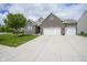 Charming brick home with a wide driveway and green lawn, perfect for Gathering living at 7632 Nestucca Trl, Noblesville, IN 46062