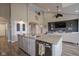 Open-concept living space featuring a large island, high ceilings, and a cozy seating area at 7632 Nestucca Trl, Noblesville, IN 46062