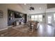 Spacious living room with ample seating, stylish decor, and plenty of natural light at 7632 Nestucca Trl, Noblesville, IN 46062