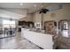 Open concept living room and kitchen area with a large sectional sofa and modern finishes at 7632 Nestucca Trl, Noblesville, IN 46062