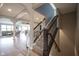 View of the staircase featuring iron spindles, carpeted steps, and an open view of the home's interior at 7632 Nestucca Trl, Noblesville, IN 46062