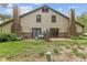 A cozy backyard space featuring a small patio, lush greenery, and a charming outdoor seating area at 774 Chapel Pines W Dr, Indianapolis, IN 46234