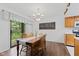Dining room with wood table and chairs, a chalkboard sign, and a sliding glass door at 774 Chapel Pines W Dr, Indianapolis, IN 46234