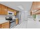Bright kitchen featuring white countertops, stainless steel appliances, and wood cabinets at 774 Chapel Pines W Dr, Indianapolis, IN 46234