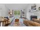 Inviting living room with fireplace, stylish decor, natural light, and hardwood floors at 774 Chapel Pines W Dr, Indianapolis, IN 46234