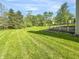 Enjoy outdoor living on this expansive lot with mature trees and lush green grass at 817 Timber Creek Dr, Indianapolis, IN 46239
