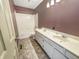 Bathroom featuring a double vanity, tile floors, and a bathtub with a shower at 817 Timber Creek Dr, Indianapolis, IN 46239