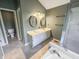 Bathroom featuring double sink vanity, tiled floor, and a shower with glass door at 817 Timber Creek Dr, Indianapolis, IN 46239