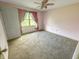 Bedroom featuring window with curtains and neutral carpet at 817 Timber Creek Dr, Indianapolis, IN 46239