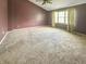 Bedroom featuring a window with natural light and neutral carpeting at 817 Timber Creek Dr, Indianapolis, IN 46239