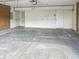Large two-car garage with a concrete floor and access to the house at 817 Timber Creek Dr, Indianapolis, IN 46239