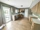 Functional kitchen with wood cabinets and sliding door access to the backyard at 817 Timber Creek Dr, Indianapolis, IN 46239