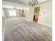 Open-concept living area with stairs and a view to the kitchen at 817 Timber Creek Dr, Indianapolis, IN 46239