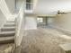 Inviting living room with a staircase and expansive carpeted area at 817 Timber Creek Dr, Indianapolis, IN 46239