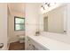Bathroom with vanity and mirror, featuring a combination tub and shower at 8415 Los Robles Rd, Fishers, IN 46038