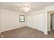 Bedroom with neutral walls, carpet flooring, and built-in closet storage at 8415 Los Robles Rd, Fishers, IN 46038