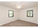 Bedroom with neutral walls, carpet flooring, a ceiling fan and bright natural lighting at 8415 Los Robles Rd, Fishers, IN 46038