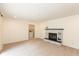 Cozy living room featuring neutral carpet, a brick fireplace, and washer/dryer hookups at 8415 Los Robles Rd, Fishers, IN 46038