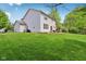 Well-maintained backyard with a lush green lawn and a patio area perfect for outdoor seating and entertainment at 8745 Providence Dr, Fishers, IN 46038
