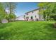 Large backyard with well-maintained lawn, patio, and shed, ideal for outdoor activities at 8745 Providence Dr, Fishers, IN 46038