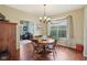 Bright dining room featuring hardwood floors, a round table, and a large window at 8745 Providence Dr, Fishers, IN 46038