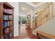 Spacious entryway with wood floors, staircase, and open view to the living room at 8745 Providence Dr, Fishers, IN 46038