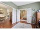 Inviting foyer with hardwood floors and view to dining room and staircase with natural light at 8745 Providence Dr, Fishers, IN 46038