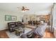 Spacious living room with hardwood flooring, comfortable furniture and natural lighting at 8745 Providence Dr, Fishers, IN 46038