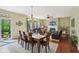 A dining room and living room with fireplace and sliding doors to the backyard at 8745 Providence Dr, Fishers, IN 46038