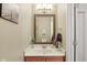 Bathroom with modern vanity, decorative mirror, and neutral wall color at 8745 Providence Dr, Fishers, IN 46038