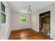 Bedroom featuring hardwood floors, a closet, and natural light at 9170 W Old Nashville Rd, Columbus, IN 47201