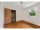 Bedroom with hardwood floors and a window overlooking the outdoors at 9170 W Old Nashville Rd, Columbus, IN 47201