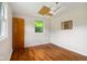 A bedroom featuring hardwood floors and natural light at 9170 W Old Nashville Rd, Columbus, IN 47201