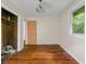 Bedroom with hardwood floors, a closet, and natural light at 9170 W Old Nashville Rd, Columbus, IN 47201