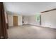 Spacious living room with laminate flooring, neutral walls, and natural light at 9170 W Old Nashville Rd, Columbus, IN 47201