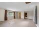 Spacious living room with laminate flooring, neutral walls, and natural light at 9170 W Old Nashville Rd, Columbus, IN 47201