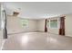 View of the spacious room with multiple windows and neutral paint at 9170 W Old Nashville Rd, Columbus, IN 47201